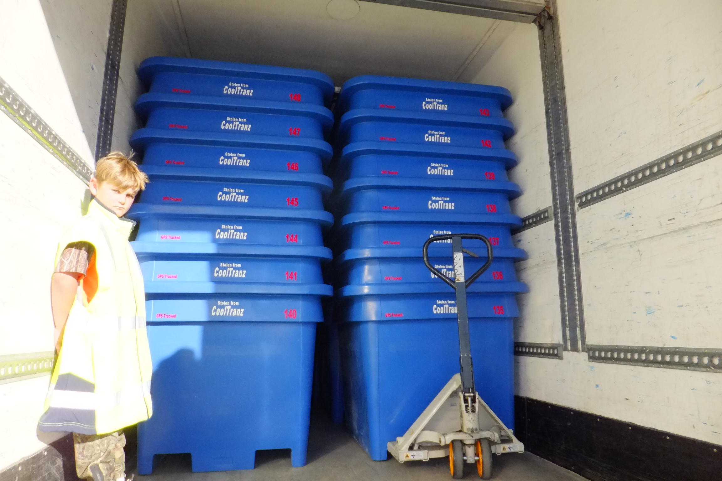 blue nested industrial grade plastic bins on truck